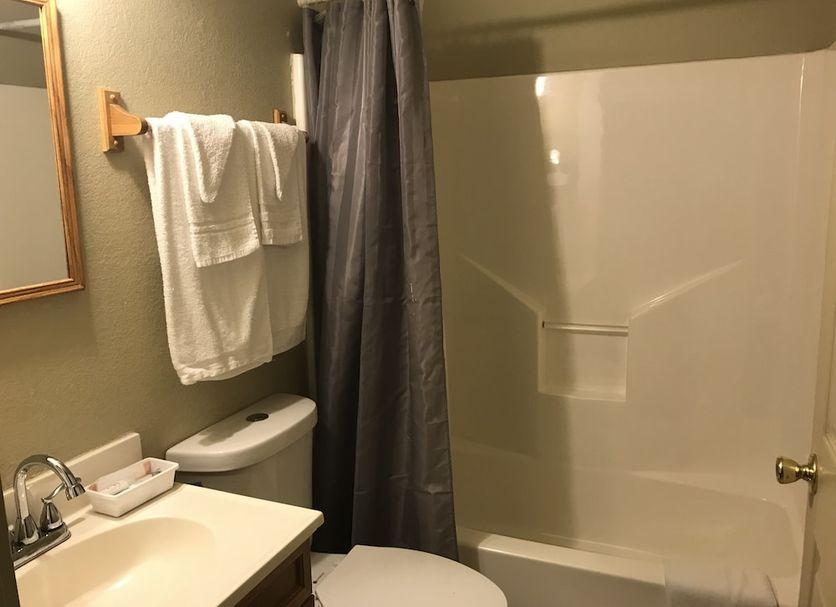 Bathroom with a shower and tiled floor