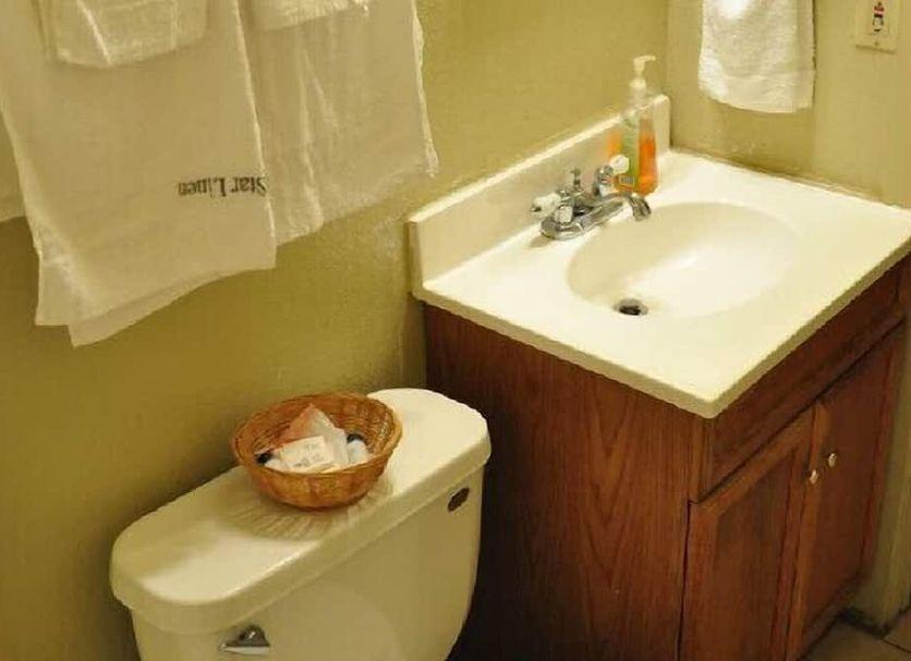 Bathroom sink and mirror in a guest room