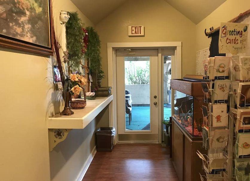 Front desk hallway with local information and greeting cards
