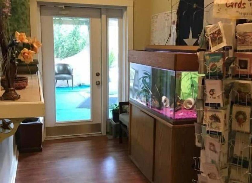 Lobby with an aquarium and a door out to the patio