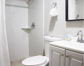 Private bathroom with a newly renovated shower and vanity